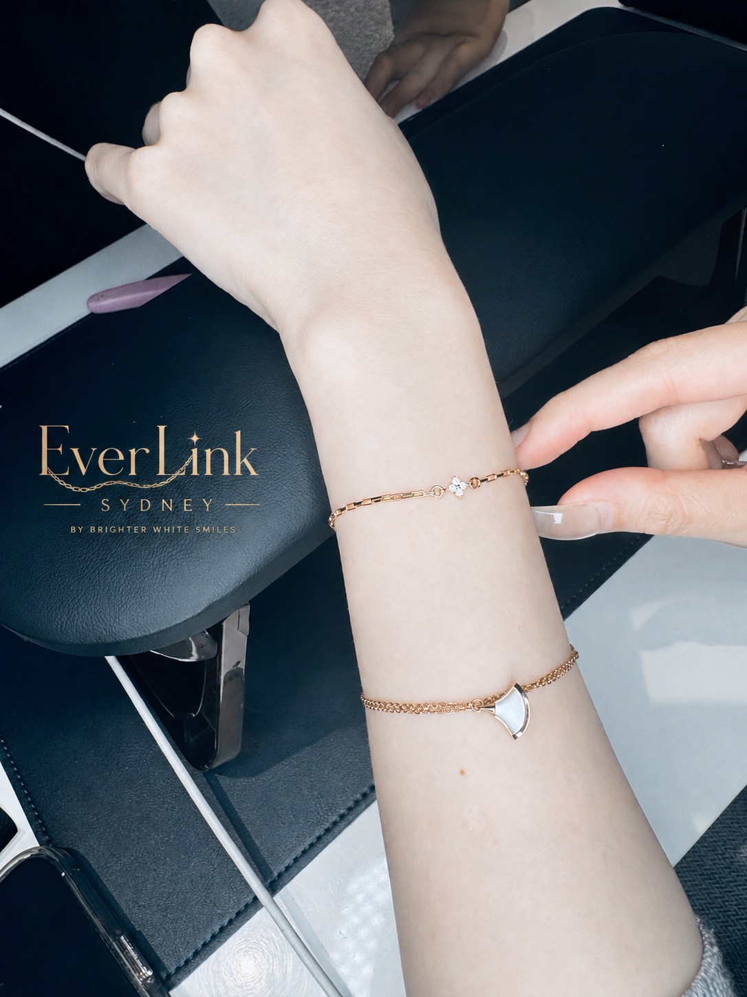 A newly fitted gold permanent bracelet with a delicate charm